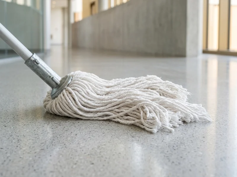 Fresh cotton wet mop head on a polished floor