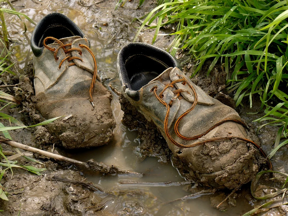 Muddy shoes — the dirt Mats That Matter stops at the door